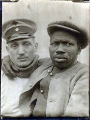 A wounded Senegalese prisoner of war is carried to a bandaging station, November 1914