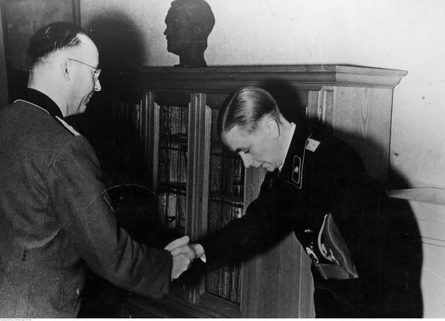Heinrich Himmler presents the Oak Leaf to the Knight's Cross with Lieutenant Otto Carius.jpg