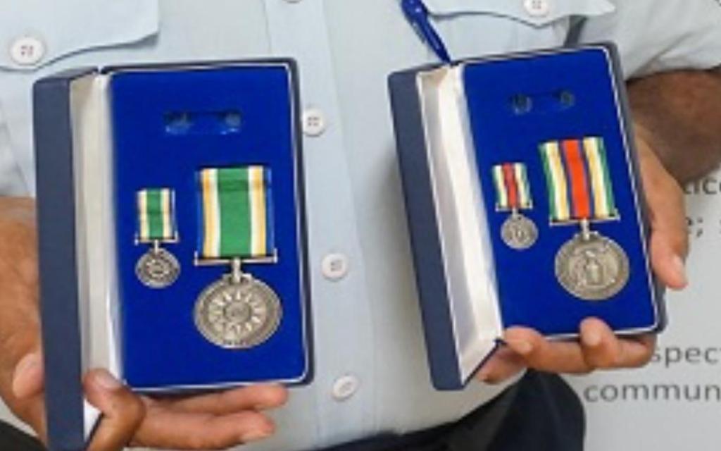 Nauru Police Outstanding Performance Medal & Police International Law Enforcement Parrtnership medal.jpg