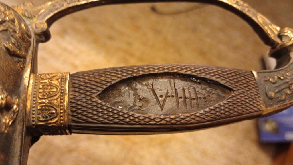 VIIII carved in handle with 9 dots.jpg